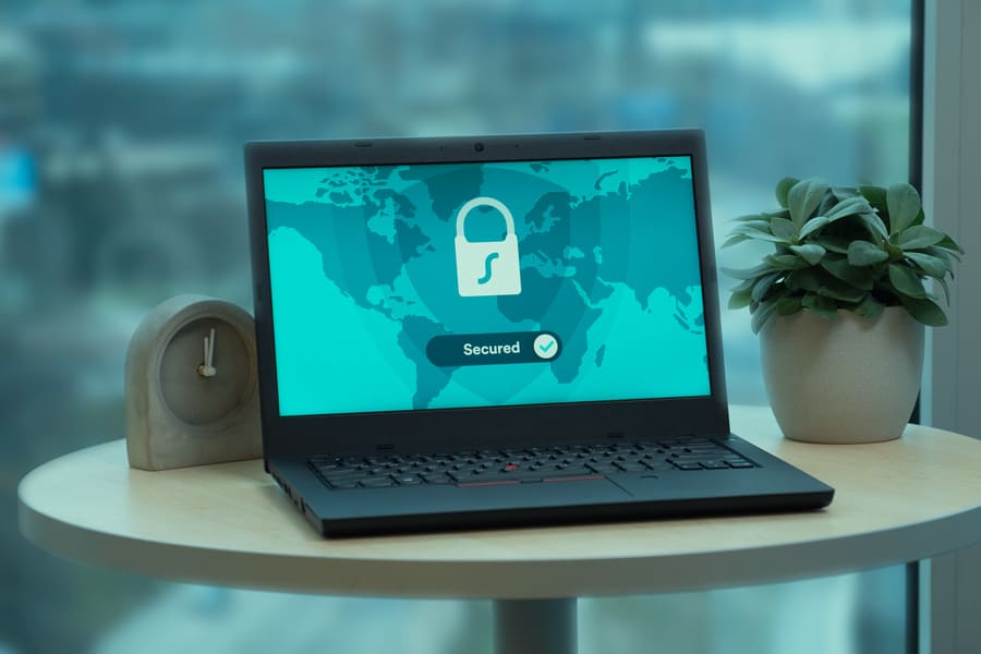 A laptop showing a secured status screen